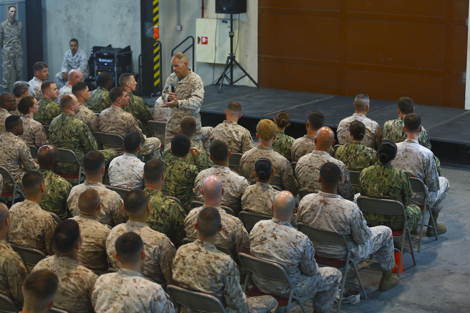 Commandant of the Marine Corps, Gen. Robert B. Neller speaks to the Marines and Sailors with Naval Amphibious Forces, Task Force 51/5th Marine Expeditionary Brigade (TF 51/5) during a town-hall meeting aboard Naval Support Activity Bahrain, June 21. During the town-hall, Neller discussed updated social media guidance, his expectation that Marines will treat each other with dignity and respect, as well as, the importance of naval integration. (U.S. Marine Corps photo by Cpl. Travis Jordan/Released)