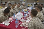 Commandant of the Marine Corps Gen. Robert B. Neller eats lunch with U.S. Marines with Special Purpose Marine Air Ground Task Force Crisis Response Central Command in the Fifth Fleet area of operations, June 21, 2017. Neller visited to speak with Marines about the current state of the Corps and answer their questions. (U.S. Marine Corps photo by Cpl. Samantha K. Braun)