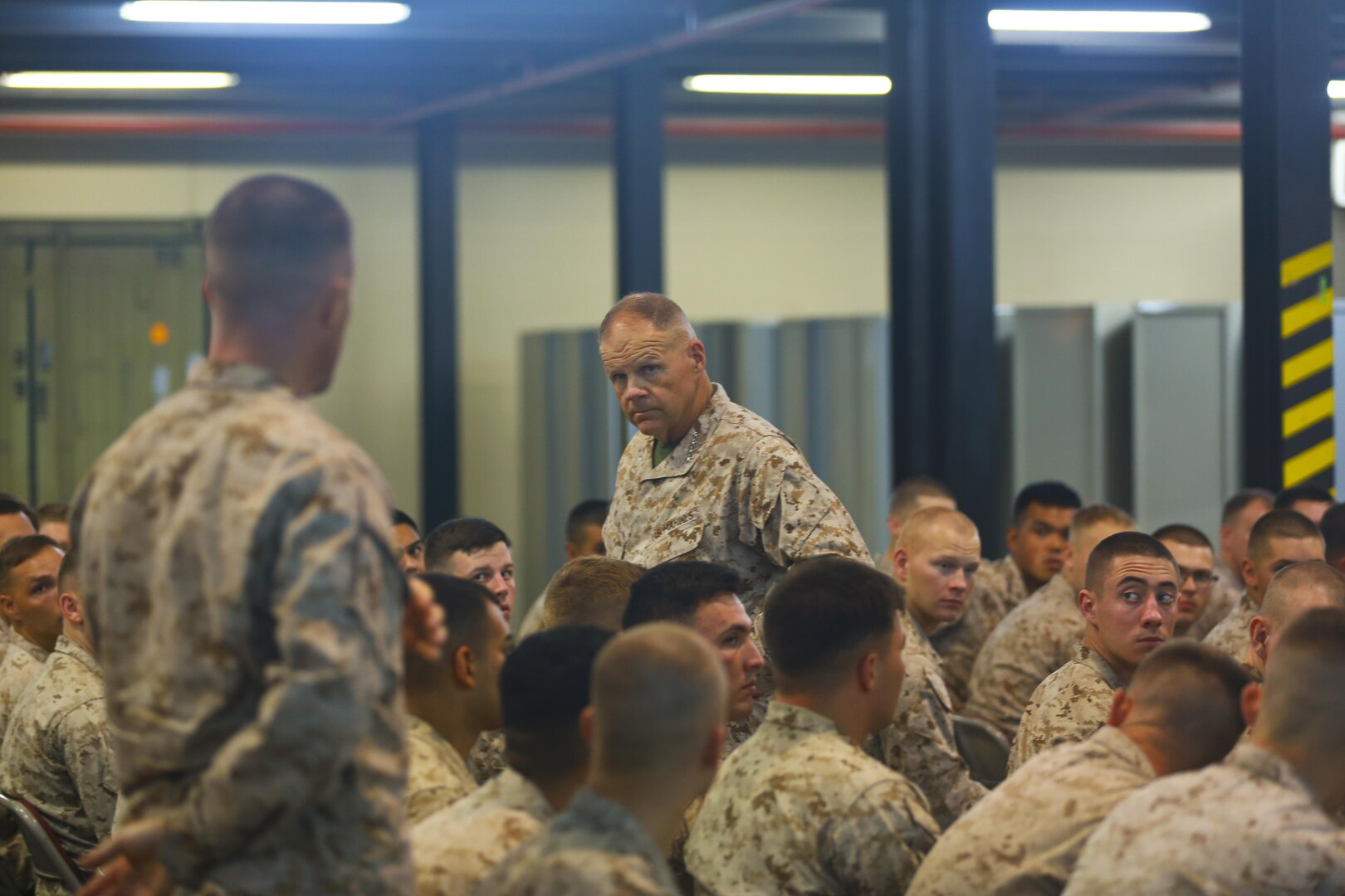 Commandant of the Marine Corps, Gen. Robert B. Neller listens to a question from a Marine with the Fleet Anti-Terrorism Security Team Central Command (FASTCENT) during a town-hall meeting aboard Naval Support Activity Bahrain, June 21. During the town-hall, Neller discussed updated social media guidance, his expectation that Marines will treat each other with dignity and respect, as well as, the importance of naval integration. (U.S. Marine Corps photo by Cpl. Travis Jordan/Released)