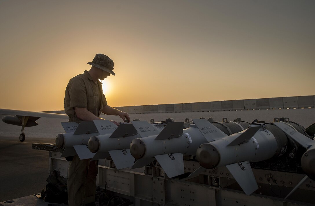 A munitions technician, assigned the 23rd Expeditionary Aircraft Maintenance Unit, prepares to load munitions on a B-52 Stratofortress assigned to the 23rd Expeditionary Bomb Squadron at an undisclosed location in Southwest Asia, June 15, 2017. The 23rd EAMU provided the 400th consecutive sortie without a maintenance cancellation on the day the 23rd EBS celebrated the 100th anniversary of the unit. (U.S. Air Force photo/ Staff Sgt. Trevor T. McBride)
