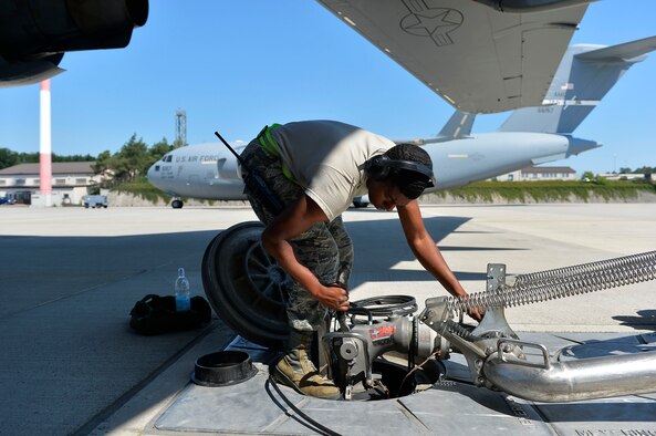 U.S. Air Force Airman 1st Class Justin Burr, 86th Logistics Readiness Squadron fuels operator, hooks up a hydrant coupler on Ramstein Air Base, Germany, June 20, 2017. The 86th Logistics Readiness Squadron’s petroleum, oils, and lubricants flight is responsible for handling the installation’s military fuel supply. (U.S. Air Force photo by Airman 1st Class Joshua Magbanua)