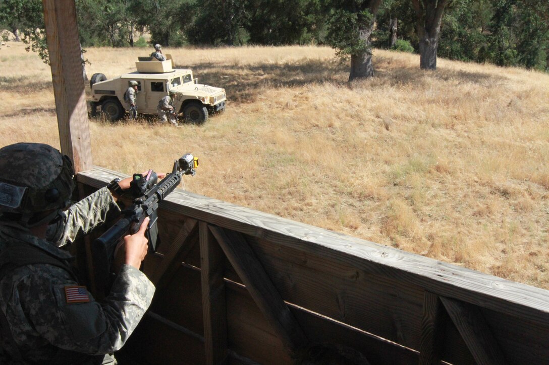 Soldiers from the 341st Military Police Company, 200th Military Police command react to simulated small arms fire during a situational training exercise at Fort Hunter Liggett, Calif., June 19, 2017. More than 3000 U.S. Army Reserve soldiers are participating in the 84th Training Command's Warrior Exercise (WAREX) 19-17-03 at Fort Hunter Liggett, Calif.; the WAREX is a large-scale collective training platform to generate capable, lethal and combat ready forces. U.S. Army photo by Capt. Patrick Cook