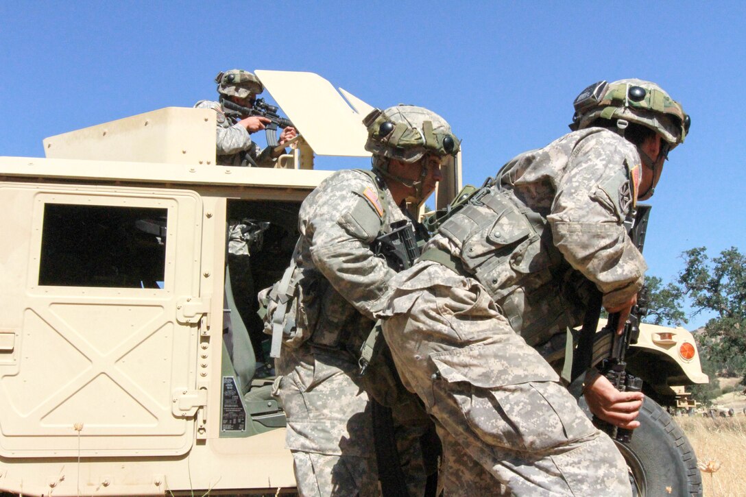 Soldiers from the 341st Military Police Company, 200th Military Police Command assault forward during a simulated firefight at Fort Hunter Liggett, Calif., June 19, 2017.More than 3000 U.S. Army Reserve soldiers are participating in the 84th Training Command's Warrior Exercise (WAREX) 19-17-03 at Fort Hunter Liggett, Calif.; the WAREX is a large-scale collective training platform to generate capable, lethal and combat ready forces. U.S. Army photo by Capt. Patrick Cook.