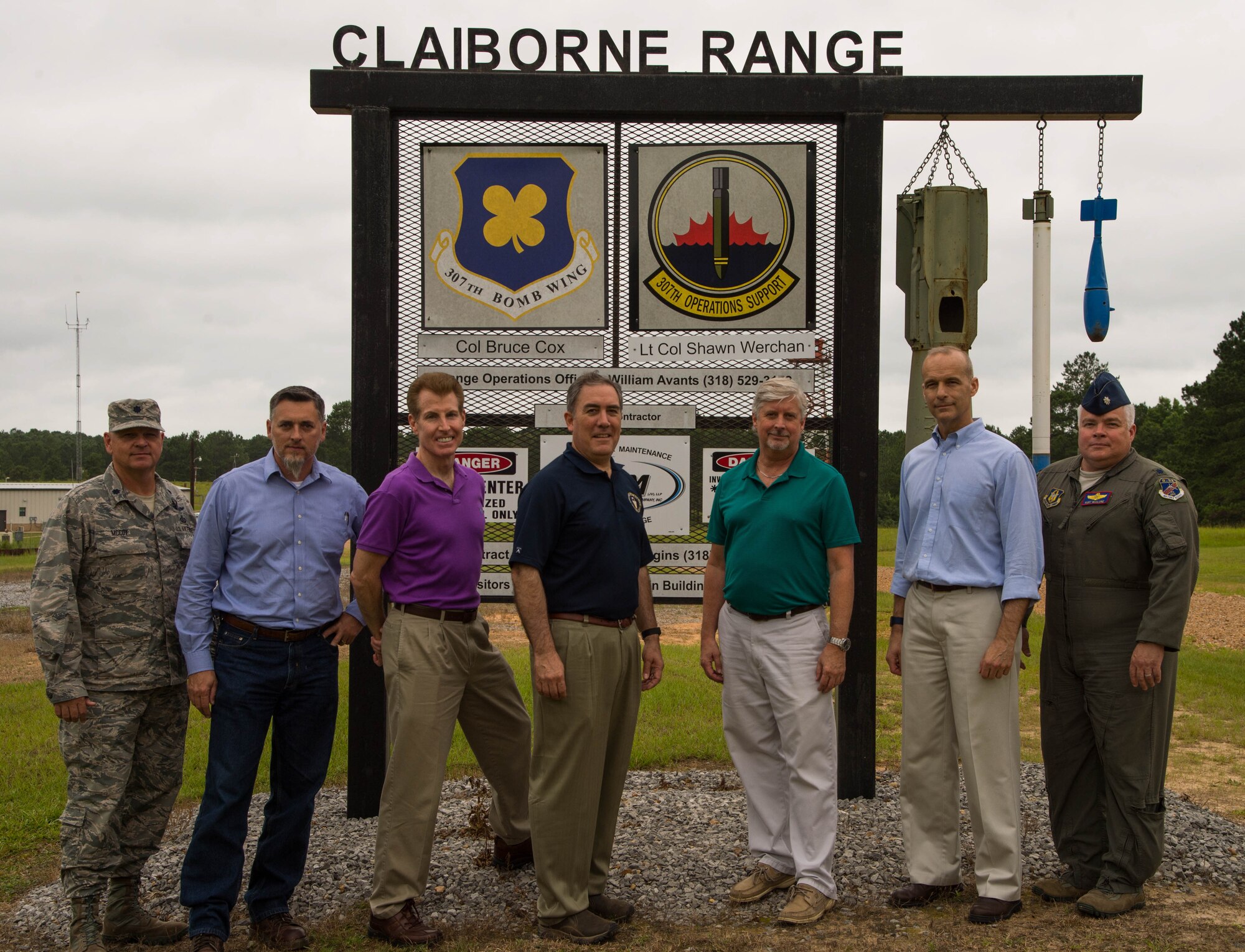 Members of the Office of the Assistant Secretary of the Air Force for Installations, Environment and Energy and the 307th Operations Support Squadron pose in front of the Claiborne Range sign at Claiborne Range near Alexandria, La., June 21, 2017. The range is located within the Kisatchie National Forest and provides aircrews the opportunity to receive real time Electronic Countermeasure training and also acts as a conventional bombing, exercise and target range for all branches of the military.  (U.S. Air Force photo by Staff Sgt. Jason McCasland/Released)