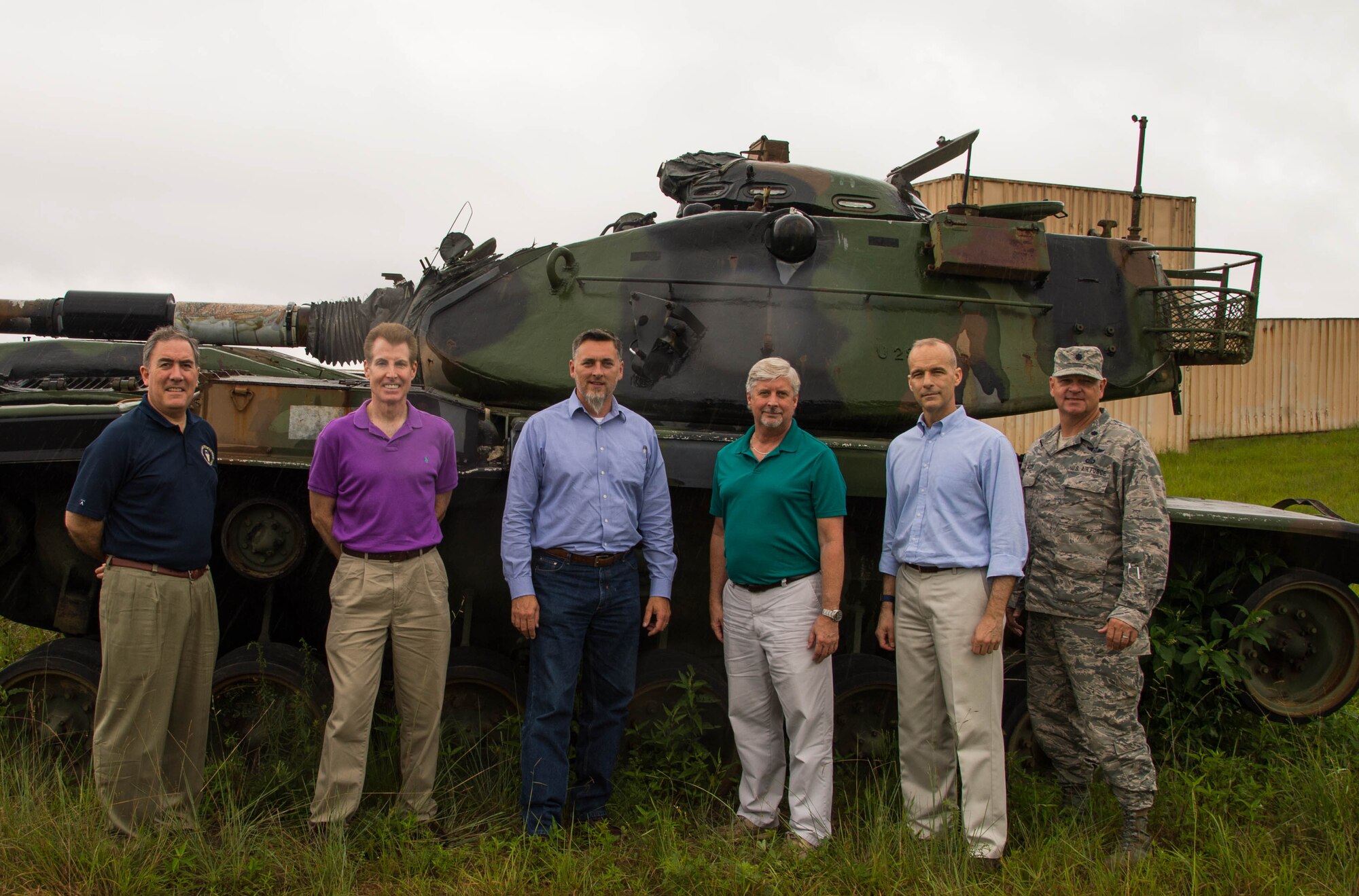 Members of the Office of the Assistant Secretary of the Air Force for Installations, Environment and Energy and the 307th Operations Support Squadron pose in front of a decommissioned M60 Patton tank at Claiborne Range near Alexandria, La., June 21, 2017. The visitors toured the range to see first-hand how using the range for training in the B-52 Stratofortress is saving fuel versus flying to other ranges. They also saw improvements that allow for a more diversified training from other local units, and plans for future improvements to allow more types of weapons to be used on the range.  (U.S. Air Force photo by Staff Sgt. Jason McCasland/Released)