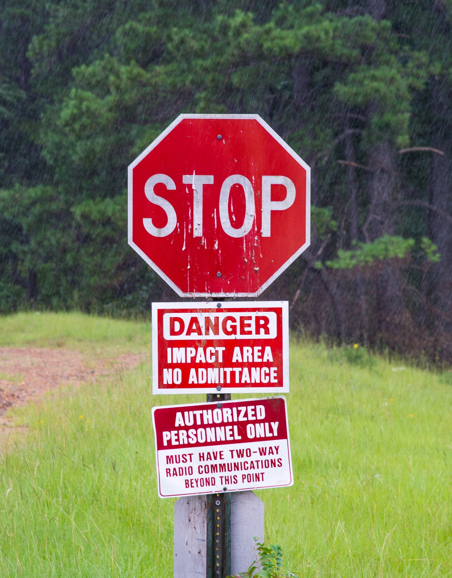 A stop sign warns visitors at Claiborne Range near Alexandria, La. prior to entering the munitions impact area June 21, 2017. The range is an Air Force Reserve Command primary training range located within the Kisatchie National Forest and provides aircrews the opportunity to receive real time Electronic Countermeasure training and also acts as a conventional bombing, exercise and target range for all branches of the military. (U.S. Air Force photo by Staff Sgt. Jason McCasland/Released)