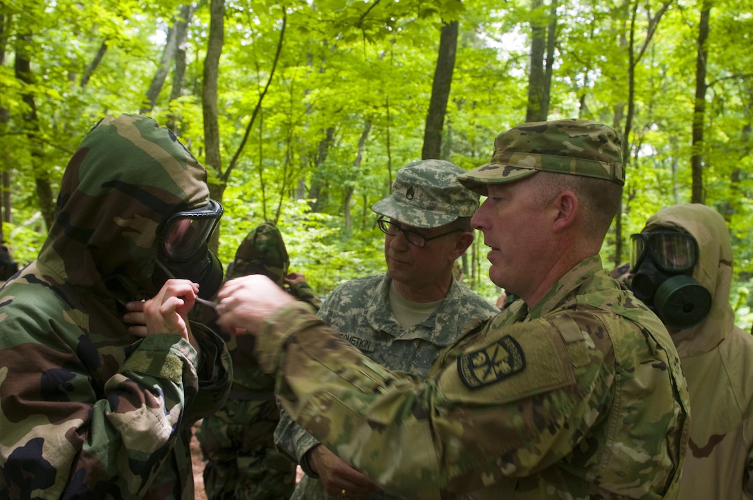 Lt. Col Jack Morgan and Staff Sgt. Steven Rudometkin, a U.S. Army Reserve training sergeant from Task Force Wolf, inspect the Mission Oriented Protective Posture gear worn by a Cadet prior to entering the gas chamber at Fort Knox, Ky. June 4, 2017.  Morgan, a chemical officer, teaches military science at Western Michigan University.  The Army Reserve has increased its role in the officer accessions across all components of the Army­ Active Duty, Reserve and National Guard in order to meet the future demand for leaders.  America’s Army Reserve generates combat ready units and Soldiers for the Army and Joint Warfighter that are trained, equipped, and lethal to win our Nation's wars.