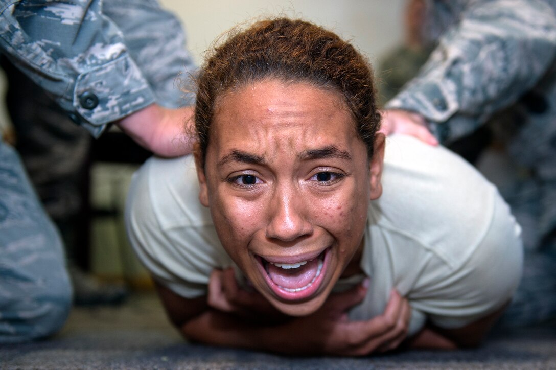 Cadet Sydnee Ramsey, New Mexico State University Detachment 105, gets tased during a demonstration performed by the 23d Security Forces Squadron during Operation Air Force 2017, June 14, 2017, at Moody Air Force Base, Ga. The annual event is designed to give cadets a hands-on training experience and a glance at various mission assets at bases across the world. The program allows cadets to confirm or reassess their pursued career fields while learning different support functions to become better leaders of Airmen in the future. (U.S. Air Force photo by Senior Airman Greg Nash)