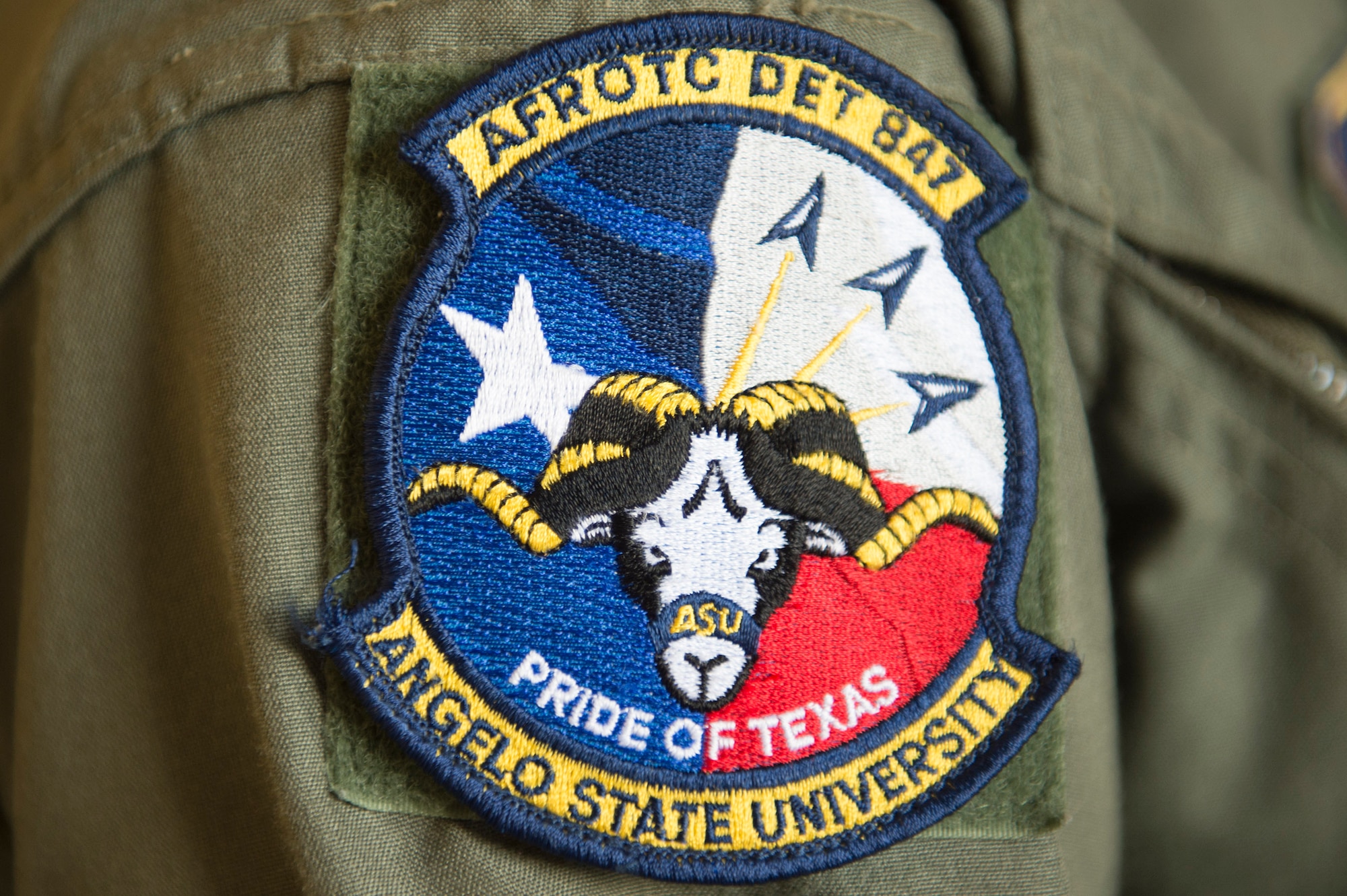 An Angelo State University, Air Force Air Force Reserve Officers’ Training Corps Det. 847 patch rests on a cadet during Operation Air Force, June 16, 2017, at Moody Air Force Base, Ga. The annual event is designed to give cadets a hands-on training experience and a glance at various mission assets at bases across the world. The program allows cadets to confirm or reassess their pursued career fields while learning different support functions to become better leaders of Airmen in the future. (U.S. Air Force photo by Senior Airman Greg Nash)