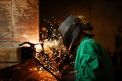 Airman 1st Class Hogan Lambeth, 11th Civil Engineer Squadron structural apprentice, welds a metal casing on a salt truck at Joint Base Andrews, Md., June 21, 2017. The new casing will help ensure the 11th Wing’s mission isn’t impeded by winter weather. (U.S. Air Force photo by Senior Airman Delano Scott) 