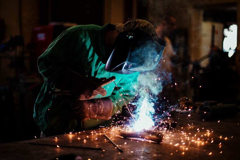 Airman 1st Class Hogan Lambeth, 11th Civil Engineer Squadron structural apprentice, welds a metal rod at Joint Base Andrews, Md., June 21, 2017. As a metals structural technician, Lambeth is called on to complete welding, sheet metal, duct work, fabrication and repairs to maintain equipment and facilities throughout the base. (U.S. Air Force photo by Senior Airman Delano Scott)   