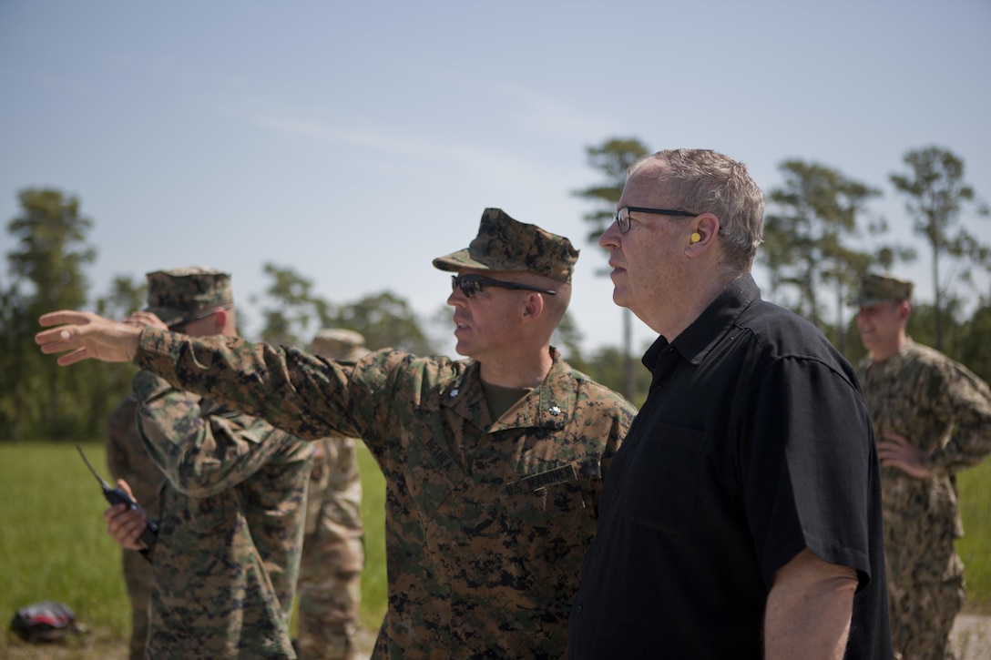 The Deputy Secretary of Defense, Honorable Mr. Robert O. Work, right, speaks with Lt. Col. Theodore Bethea, commanding officer of Advanced Infantry Training Battalion-East, School of Infantry- East, at Camp Lejeune, N.C., June 2, 2017. Marines from the School of Infantry demonstrated a live fire exercise as a part of training to diplomats and military personnel during their visit to the base.  (U.S. Marine Corps photo by Lance Cpl. Tyler Pender)