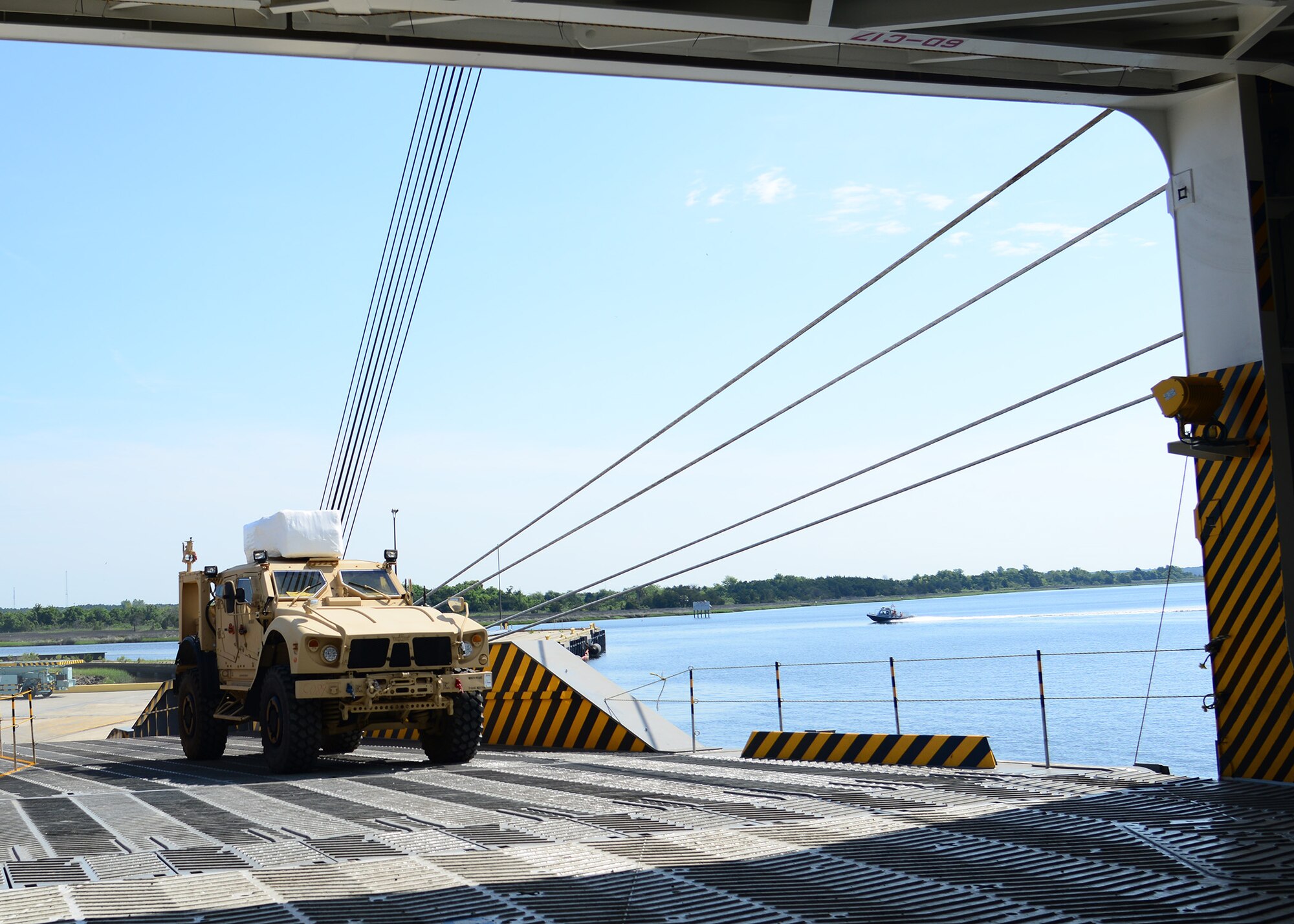 A Mine-Resistant Ambush Protected vehicle is on-loaded onto the Liberty Maritime Corporation’s ship Liberty Passion at Joint Base Charleston, S.C., June 15, 2017. Members from the 841st Transportation Battalion staged, processed and configured the equipment in support of Marine Corps pre-positioning and staging across Europe and Asia. The 841st TB conducts surface distribution and port clearance operations in support of Geographic Combatant Commanders and deployment readiness.  