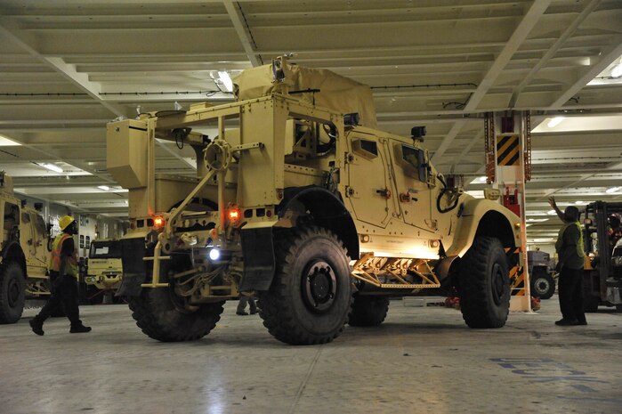 Civilians and U.S. Army Soldiers assigned to the 841st Transportation Battalion on-load Mine-Resistant Ambush Protected vehicles onto the Liberty Maritime Corporation’s ship Liberty Passion at Joint Base Charleston, S.C., June 15, 2017. Members from the 841st TB staged, processed and configured the equipment in support of Marine Corps pre-positioning and staging across Europe and Asia. The 841st TB conducts surface distribution and port clearance operations in support of Geographic Combatant Commanders and deployment readiness.  