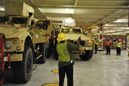 Civilians and U.S. Army Soldiers assigned to the 841st Transportation Battalion on-load Mine-Resistant Ambush Protected vehicles onto the Liberty Maritime Corporation’s ship Liberty Passion at Joint Base Charleston, S.C., June 15, 2017. Members from the 841st TB staged, processed and configured the equipment in support of Marine Corps pre-positioning and staging across Europe and Asia. The 841st TB conducts surface distribution and port clearance operations in support of Geographic Combatant Commanders and deployment readiness.