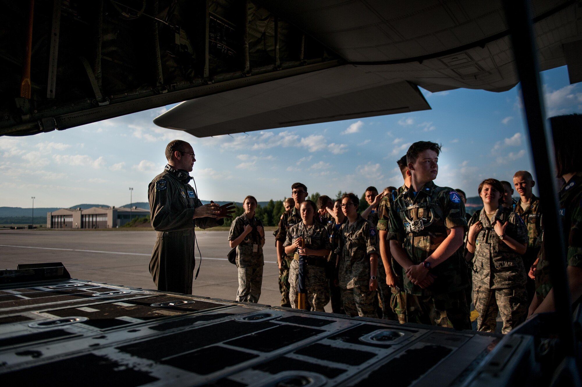 U.S. Air Force Airman 1st Class Scott Coleman, 37th Airlift Squadron aircraft loadmaster gives Civil Air Patrol cadets a tour of a C-130J Super Hercules on Ramstein Air Base, Germany, June 20, 2017. Coleman explained the aircraft’s role to the cadets and how it operates. (U.S. Air Force photo by Senior Airman Devin Boyer)