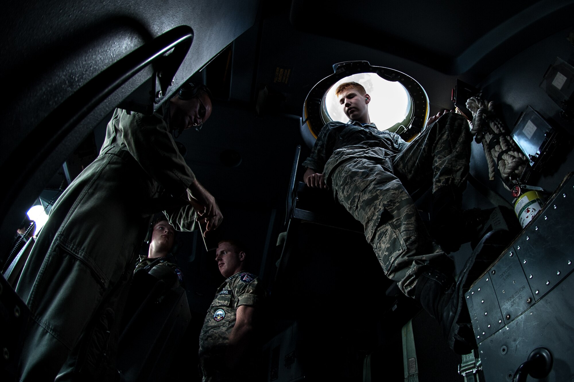 Civil Air Patrol Cadet Master Sgt. Ryan Stein, Wiesbaden Cadet Flight, sits in the bubble of a C-130J Super Hercules assigned to the 37th Airlift Squadron on Ramstein Air Base, during a flight over Rheinland-Pfalz, Germany, June 20, 2017. The bubble allows people to look out of the top of the aircraft to get a 360 degree perspective. Cadets took turns looking out of the bubble so they could each enjoy the view. (U.S. Air Force photo by Senior Airman Devin Boyer)