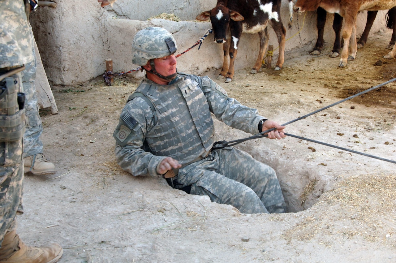 Army 1st Lt. Scott Dewitt, with Bravo Company, 2nd Battalion, 508th Infantry Regiment, rappels underground to search for a weapons cache in Bagi Khel, Afghanistan, in 2007. Finding tunnels and holes such as this one was made easier with the deployment of the Rapid Reaction Tunnel Detection system in 2014. Army photo by Staff Sgt. Marcus J. Quarterman