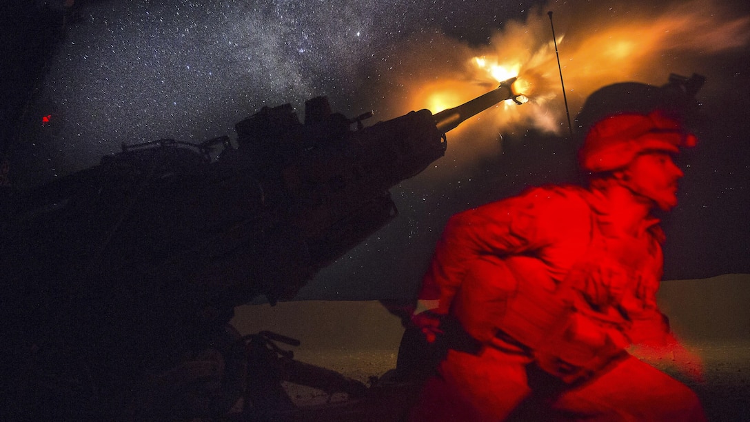 A Marine fires an M777A2 howitzer in the early morning in Syria, June 3, 2017. Marines have been conducting 24-hour all-weather fire support for the coalition’s local partners, the Syrian Democratic Forces, to support Combined Joint Task Force Operation Inherent Resolve. Marine Corps photo by Sgt. Matthew Callahan