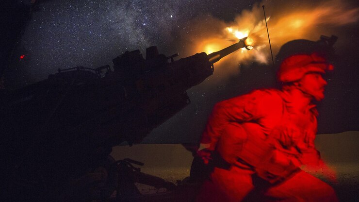 A Marine fires an M777A2 howitzer in the early morning in Syria, June 3, 2017. Marines have been conducting 24-hour all-weather fire support for the coalition’s local partners, the Syrian Democratic Forces, to support Combined Joint Task Force Operation Inherent Resolve. Marine Corps photo by Sgt. Matthew Callahan