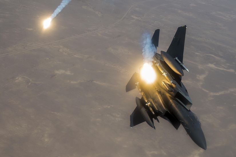 An Air Force F-15E Strike Eagle fires flares during a flight supporting Operation Inherent Resolve, June 21, 2017. Air Force photo by Staff Sgt. Trevor T. McBride