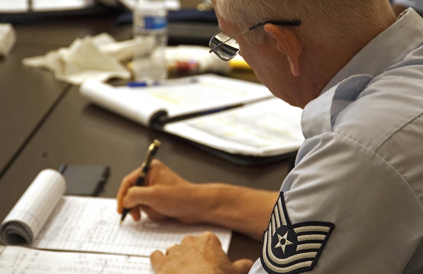 An attendee takes notes during a breakout session at the 2017 Equal Opportunity Worldwide Training Workshop on Joint Base Andrews, Md., June 15, 2017. Approximately 300 equal opportunity professionals from the Air Force Reserve, Air National Guard, Air Force active duty and U.S. government attended the week-long workshop that provided required refresher skills training. (U.S. Air Force photo by Christopher Hurd)