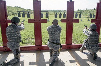 Weapons qualification course students fire their Beretta M9 pistols during the range portion of their training July 6, 2015, at the Joint Base San Antonio-Lackland Medina Annex. During this portion, students practice both kneeling and standing firing positions and record the accuracy of their hits with combat arms instructors to verify their weapon competency. The weapons qualification course is part of the Combat Arms Training and Maintenance program that introduces basic firearm safety and use practices for Airmen in Air Force Basic Military Training and refreshes that training for JBSA members deploying or undergoing a permanent change of station.