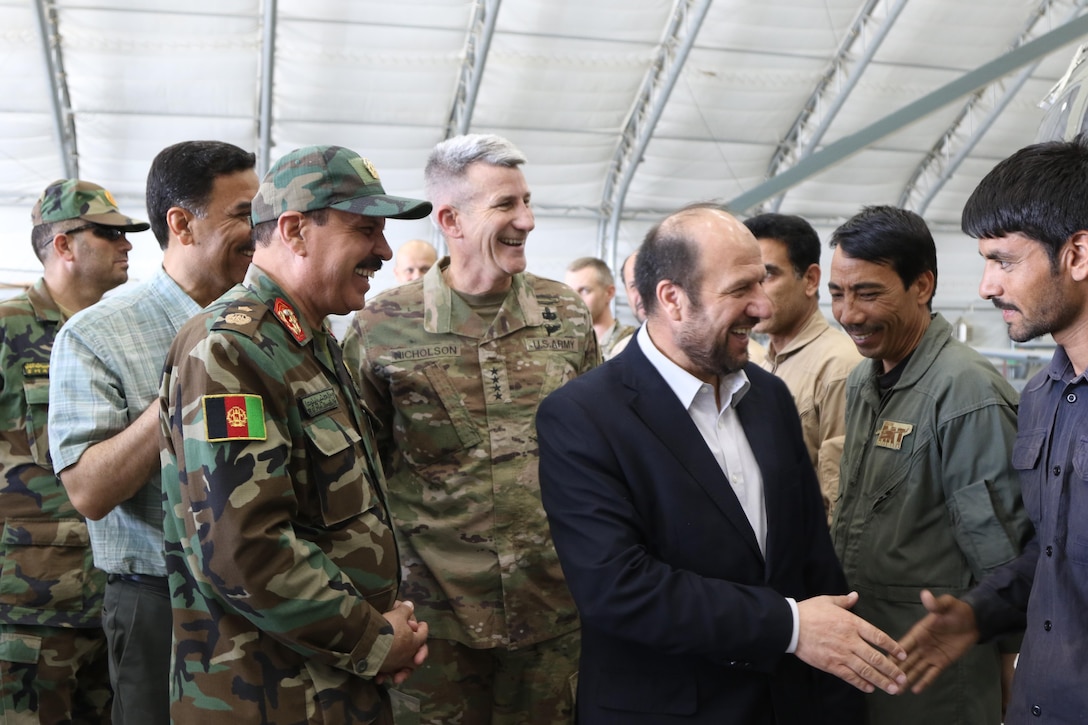 KABUL, Afghanistan (June 22, 2017) — Gen. John Nicholson, Resolute Support commander, visits Train, Advise, Assist Command – Air to assess the impact and progress of the AAF in the war against terrorism. Minister of Defense Maj. Gen. Tariq Shah Bahrami and the Minister of Interior Taj Muhammad Jahid were also present during the briefing and tour of the AAF aircrafts.

The Afghan Airforce is set to expand, helping to provide the foundation and an enduring mechanism for superior power projection for the Afghan government. Their airpower includes the Mi-17 (for air transport of troops and cargo, medical evacuations, and attack), the A-29 (a strike aircraft), the MD-530 (a small attack helicopter), the C-130 (airlift), and the C-208 (airlift with airdrop capability), explained German Lt. Col. Nikolaus Nanasi, MoD Air Advisor. 

The AAF is projected to expand and will include new capabilities such as the AC-208, an aircraft which, for the first time, will provide the AAF an organic intelligence surveillance reconnaissance asset. Also, they will be empowered with 159 new UH-60 Blackhawks and additional A-29s and MD-530s.