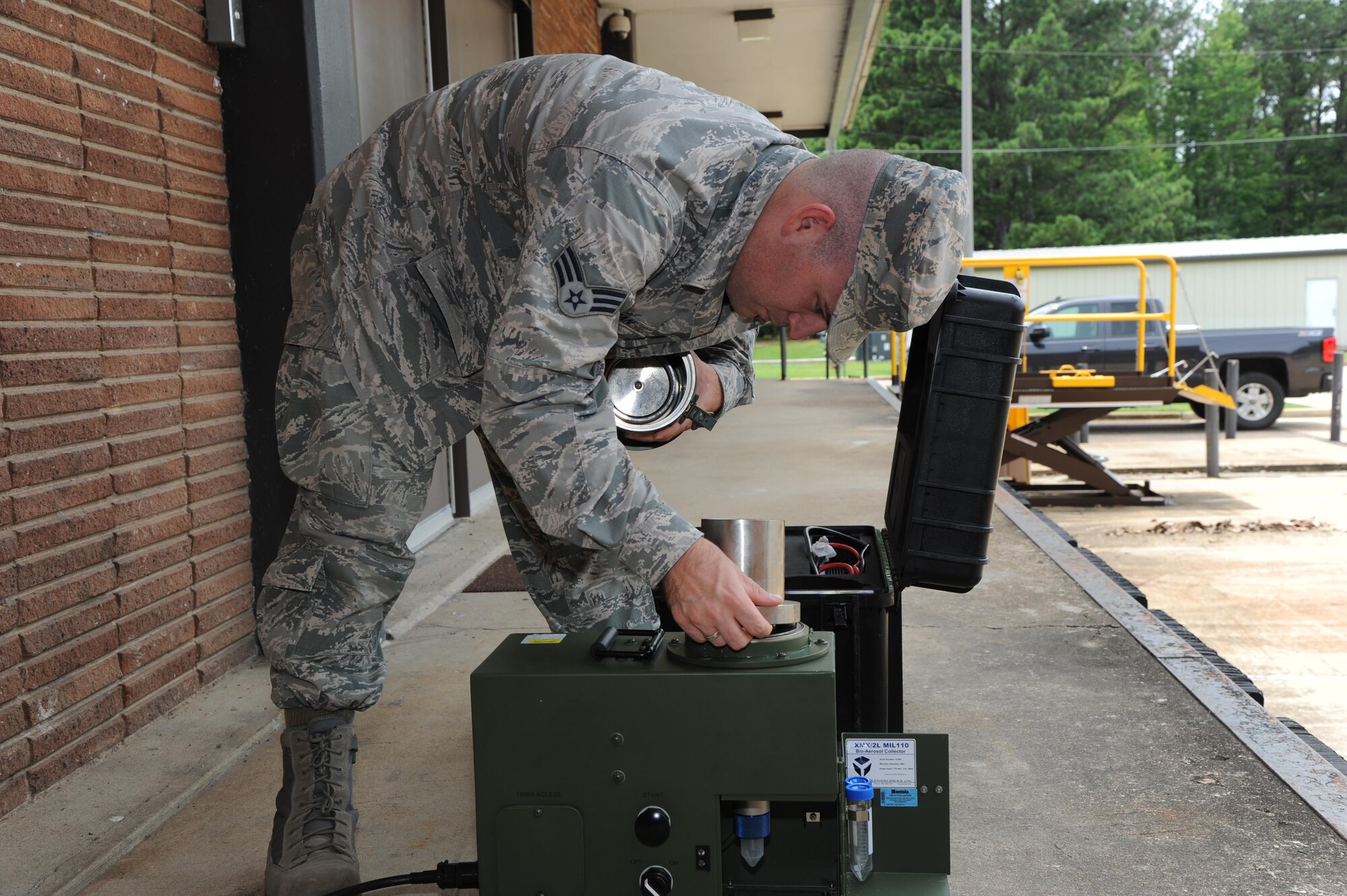 Senior Airman Kevin Morgan, 14th Medical Operations Squadron Bioenvironmental Technician, assembles an XMX machine June 20, 2017, at Columbus Air Force Base, Mississippi. The XMX is a vacuum that takes in air and runs it through water which can then be tested for chemicals and biological material. (U.S. Air Force photo by Airman 1st Class Beaux Hebert)
