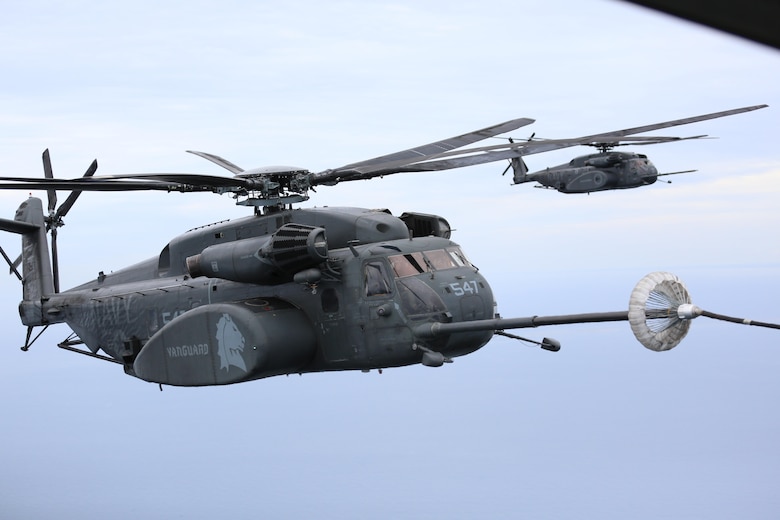 Navy MH-53E Sea Dragon helicopter refuels during a joint training aerial refueling exercise near Marine Corps Air Station Cherry Point, N.C., June 21, 2017. A U.S. Marine Corps KC-130J Super Hercules assigned to Marine Aerial Refueler Transport Squadron 252, refueled four helicopters during the exercise. Joint exercises are regularly conducted to ensure mission and operational readiness and improve interoperability. VMGR-252 is assisgned to Marine Aircraft Group 14, 2nd Marine Aircraft Wing; and the naval aircraft are from Helicopter Mine Countermeasures Squadron 14 and 15, Naval Air Force Atlantic, based at Naval Station Norfolk, Virginia. (U.S. Marine Corps photo by Pfc. Skyler Pumphret/ Released)