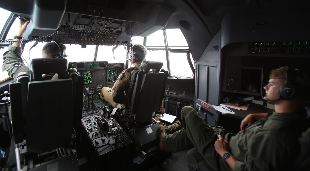 The flight crew of a KC-130J Super Hercules flies back to their home station after a joint aerial  refueling training exercise near Marine Corps Air Station Cherry Point, N.C., June 21, 2017. The crew refueled four U.S. Navy MH-53E Sea Dragon helicopters during the exercise. Joint training exercises such as this allow pilots to gain experience and improve unit readiness. The Super Hercules is assigned to Marine Aerial Refueler Transport Squadron 252, Marine Aircraft Group 14, 2nd Marine Aircraft Wing. (U.S. Marine Corps Photo by Pfc. Skyler Pumphret/ Released)