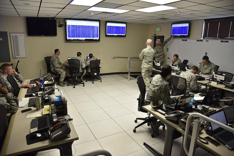 Service members work to take full accountability of 175th Wing Airmen June 22, 2017, in the emergency operations center at Warfield Air National Guard Base, Middle River, Md. The members were participating in Warfield’s first active shooter training exercise this year. (U.S. Air National Guard photo by Airman Sarah M. McClanahan)