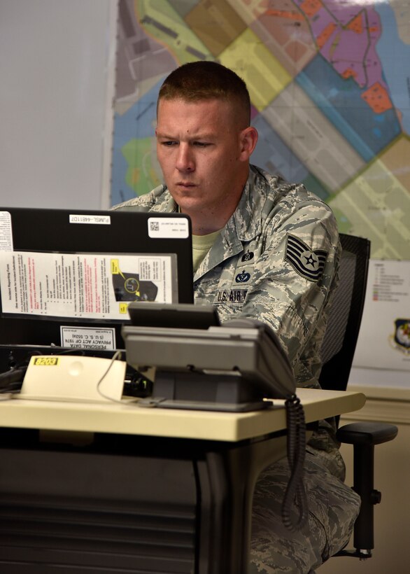 Air Force Tech. Sgt. Brenton Deal, a bioenvironmental engineer assigned to the 175th Medical Group, works on a computer June 22, 2017, in the emergency operations center at Warfield Air National Guard Base, Middle River, Md. Deal was participating in an active shooter training exercise and was assisting the EOC in taking full accountability of base Airmen. (U.S. Air National Guard photo by Airman Sarah M. McClanahan)