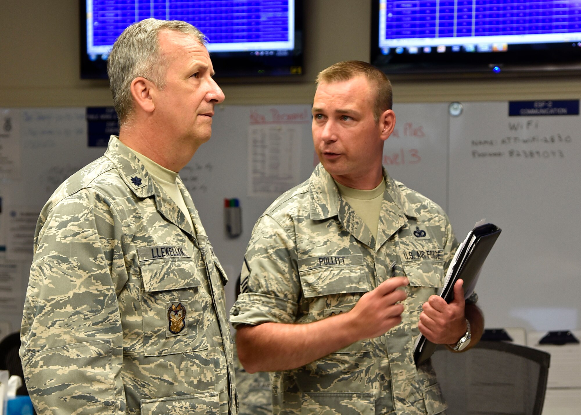 (From left) Air Force Lt. Col. Joseph J. Llewellyn, 175th inspector general, and Air Force Master Sgt. Curtis Pollitt, 175th Wing inspector general superintendent, discuss the accountability of the wing during an active shooter training exercise June 22, 2017, in the emergency operations center at Warfield Air National Guard Base, Middle River, Md. The base holds active shooter exercises twice annually and the EOC is set up throughout the year. (U.S. Air National Guard photo by Airman Sarah M. McClanahan)