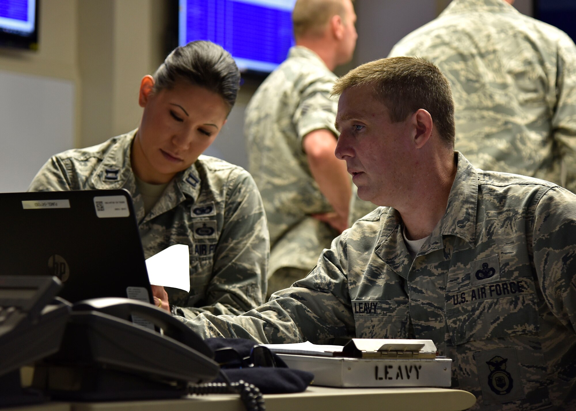 (From left) Air Force Capt. Elisa P. Shutler, 175th Security Forces Squadron deputy commander, and Air Force Chief Master Sgt. Kevin P. Leavy, 175th SFS manager, work on taking full accountability of base Airmen June 22, 2017, in the emergency operations center at Warfield Air National Guard Base, Middle River, Md. They were participating in an active shooter training exercise held on base. (U.S. Air National Guard photo by Airman Sarah M. McClanahan)