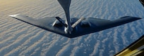 A U.S. Air Force KC-135 Stratotanker assigned to the 100th Air Refueling Wing, RAF Mildenhall, England, prepares to transfer fuel to a B-2 Spirit from Whiteman Air Force Base, Mo., off the coast of Spain, June 13, 2017. Two B-2s deployed to the U.K. to participate in theater bomber assurance and deterrence operations. Bomber deployments enhance the readiness and training necessary to respond to any contingency or challenge across the globe.