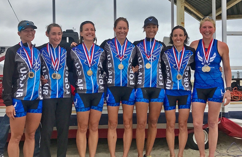 Maj. Jamie Turner, a Reserve pilot in the 317th Airlift Squadron (center)Stand with her Air Force Teammates after completing the Armed Forces Triathlon Championship, June 10, in Point Mugu, California. She finished 2nd in the Air Force, 5th overall and 2nd in the Masters category (over 35-years-old category). The Air Force women’s team took home the gold medal, and the men took silver. (Courtesy Photo)
