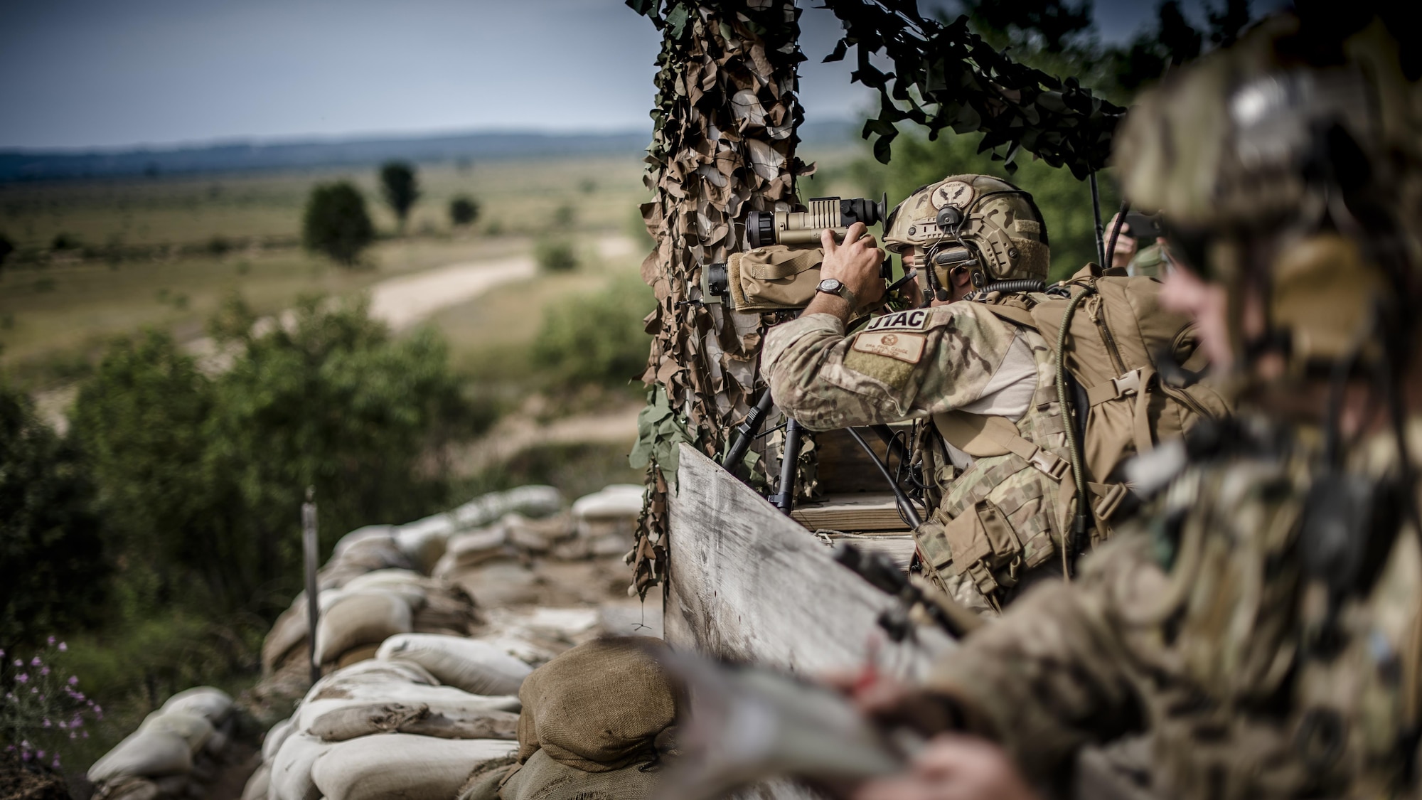 Senior Airman Paul Cauge, a 274th Air Support Operations Squadron joint terminal attack controller, uses a laser rangefinder designator for a close air support training mission July 29, 2015, at Grayling Air Gunnery Range in Grayling, Mich., during Northern Strike 2015. The annual exercise involved hundreds of military personnel from 20 states, as well as Canada, Latvia, Poland and Australia. (U.S. Air National Guard photo/Master Sgt. Scott Thompson)