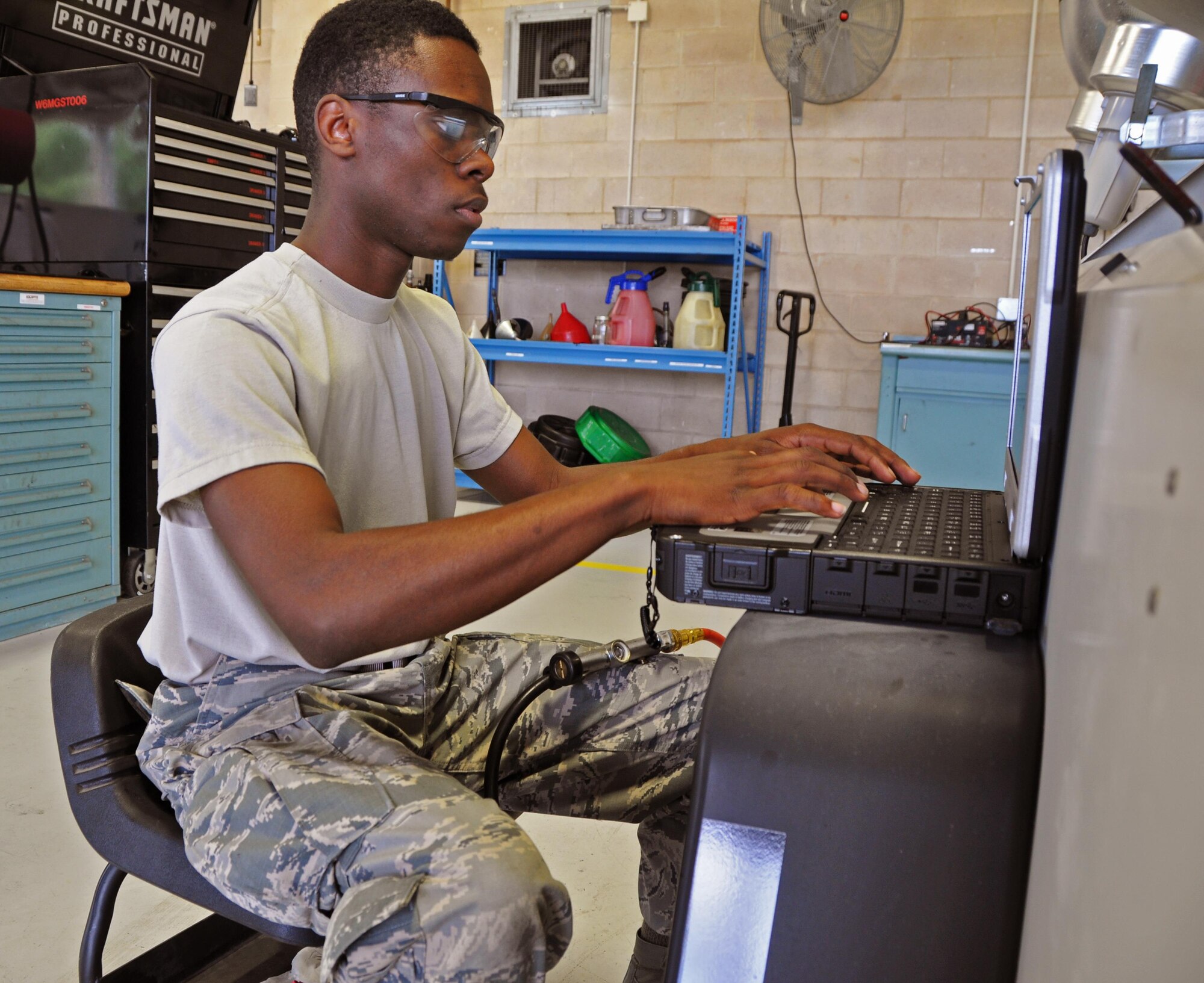 Senior Airman Xavier Green, a 919th Special Operations Maintenance Squadron aircraft ground equipment journeyman, uses a TEREX program to conduct an acceptance inspection on a portable floodlight cart at Duke Field, Fla.  The squadron's AGE flight provides fully mission capable AGE equipment to support all Duke aircraft and civil engineering requirements. (U.S. Air Force photo/Dan Neely)