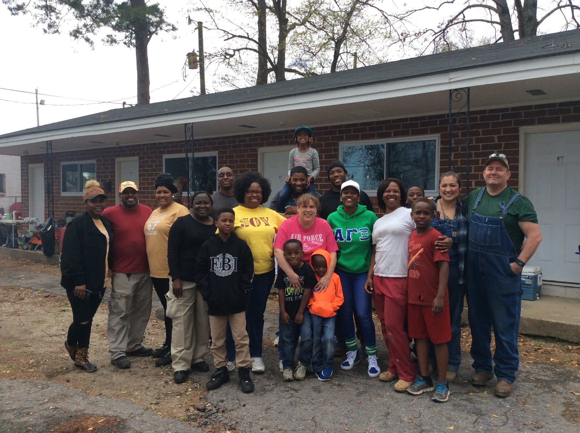 Citizen Airmen assigned to the 55th Combat Communications Squadron pose for a photo after completing a day of volunteer work with the Genesis Joy House project, headed up by Senior Airman Christina Davis. Genesis Joy House is the first transitional housing facility for homeless female veterans located in Middle Georgia.
