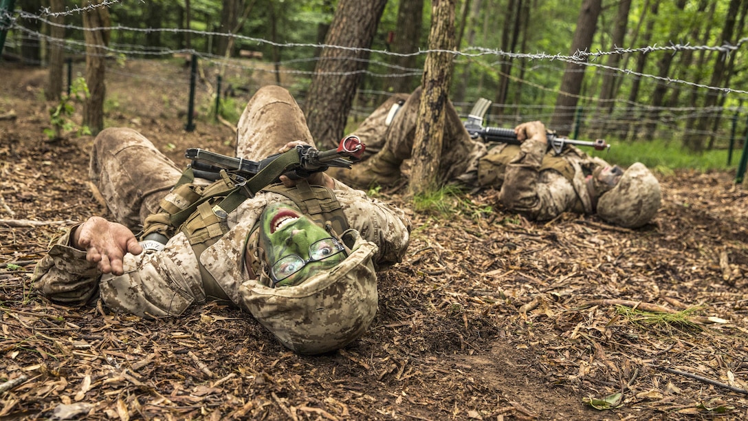 Marine Corps officer candidates participate in a fire team assault course at the Officer Candidate School at Marine Corps Base Quantico, Va., June 17, 2017. Candidates must go successfully complete three months of intensive training for commissioning as an officer. Marine Corps photo by Lance Cpl. Cristian L. Ricardo