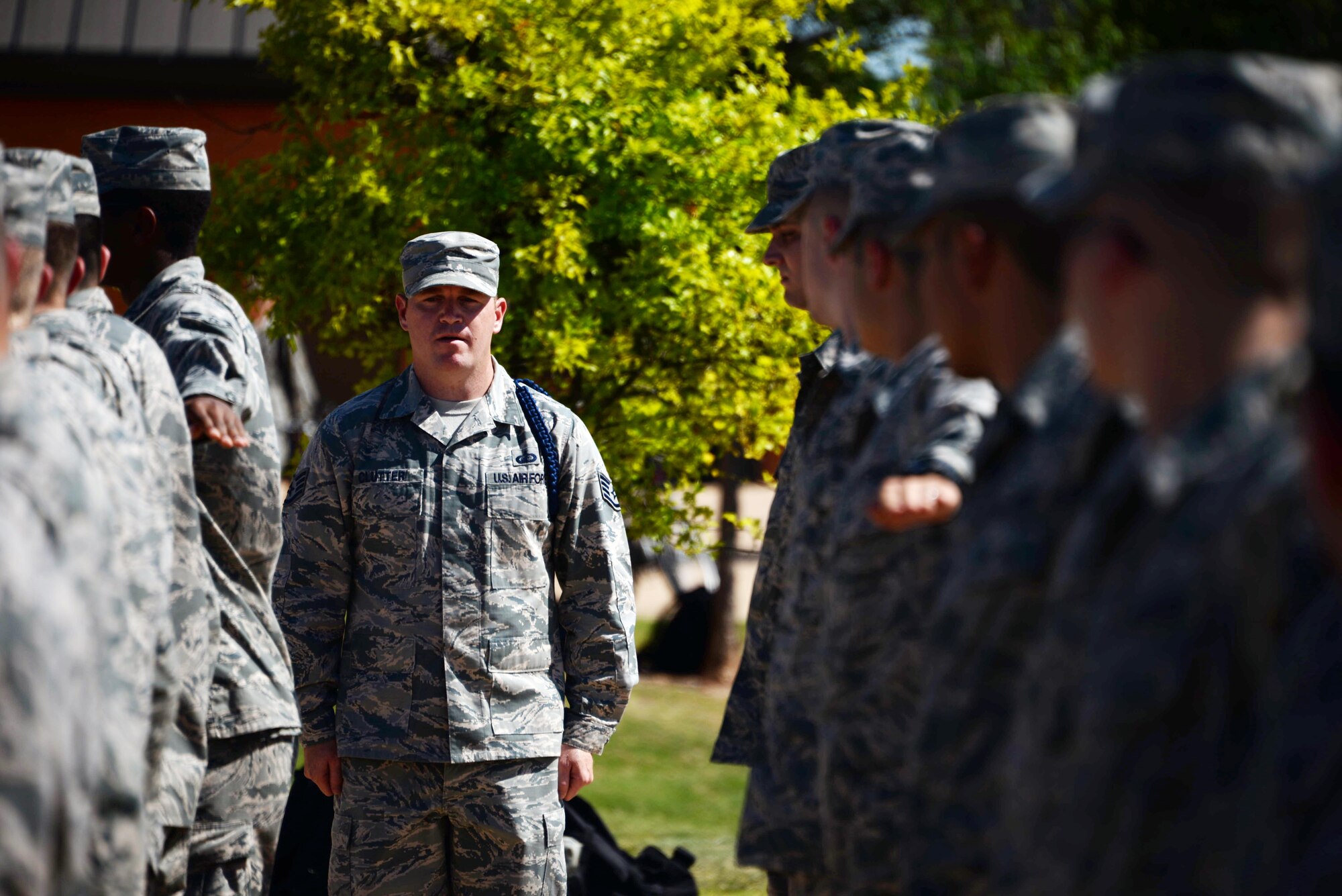Staff Sgt Timothy Clutter, 364th Training Squadron military training leader, aligns Airmen in order to properly perform an open ranks inspection. Open ranks inspections are used to ensure that Air Force Instruction 36-2903 is being properly adhered to. (U.S. Air Force photo by Senior Airman Robert L. McIlrath)