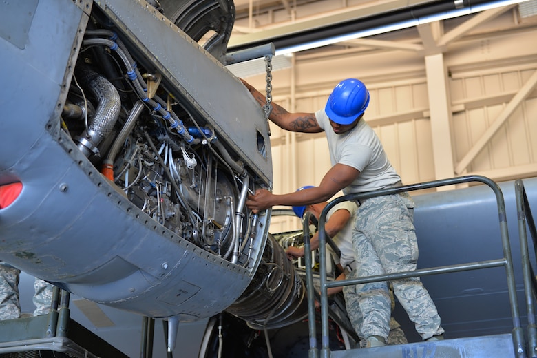 Airman Aaron Mack, 361st Training Squadron student secures the power package to the T-56 engine at Sheppard Air Force Base, Texas. This is a quick engine change stand assembly. (U.S. Air Force photo by Liz H. Colunga/Released)