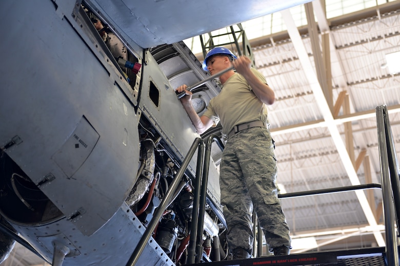 Airman Douglas Price, 361st Training Squadron student removes the power package to the T-56 engine at Sheppard Air Force Base, Texas. This is a quick engine change stand assembly. (U.S. Air Force photo by Liz H. Colunga/Released)