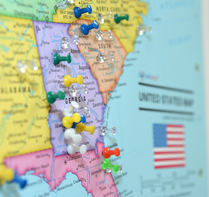 Marine Corps Logistics Base Albany and Marine Corps Logistics Command voters place their pins on a map showing where they are registered to vote during the installation’s first voting convention, here, June 22.