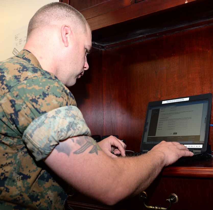 Gunnery Sgt. Tyler Nichols, ordnance officer, Logistics Support Division, Marine Corps Logistics Base Albany, registers to vote during the installation’s first voting convention, June 22.