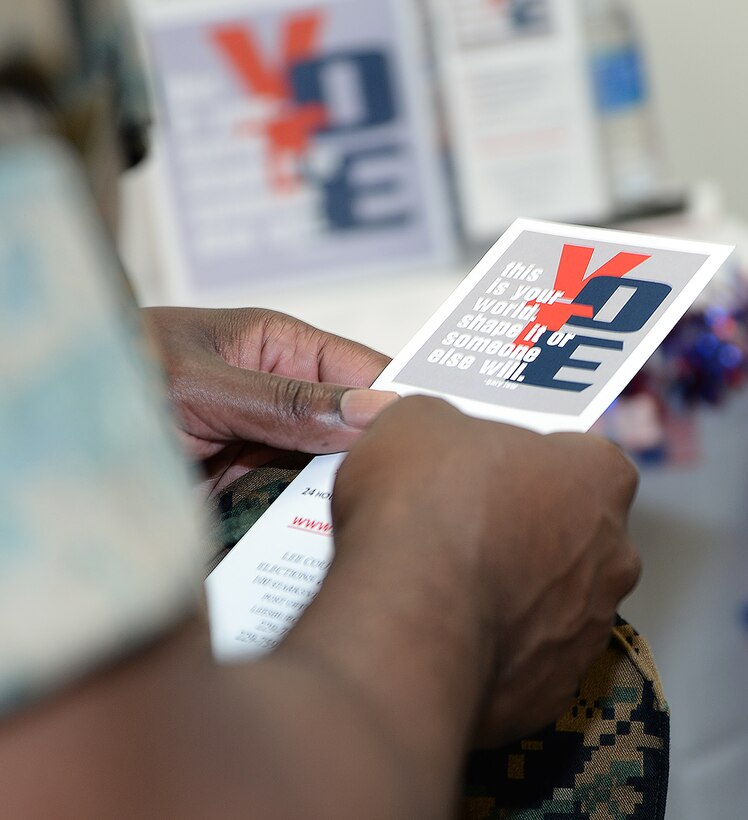 A Marine reads voting literature during the Marine Corps Logistics Base Albany’s first voting convention, June 22.