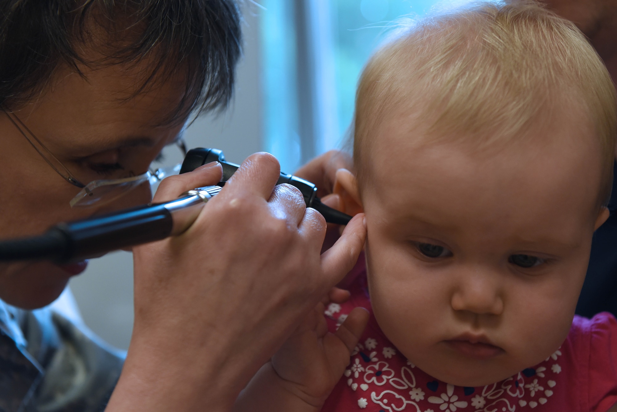 Lt. Col. Ruth Gulotta, 19th Medical Operations Support Squadron pediatrician, checks Elsie’s ear during an appointment June 6, 2017, at Little Rock Air Force Base, Ark. The pediatrics clinic is comprised of approximately eight members and sees approximately 90 patients a week. (U.S. Air Force photo by Senior Airman Mercedes Taylor) 