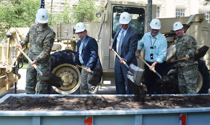From left to right, U.S. Army Garrison Fort Riley Cmd. Sgt. Major James Collins; Albert "Chip" Marin, U.S. Army Corps of Engineers, Engineering and Support Center, Huntsville; Joseph Cvetas, Executive Vice President, Southland Industries; H. Sandy Walker, Fort Riley Public Works; and Col. John Lawrence, Fort Riley Garrison Commander, turn
ceremonial dirt during a groundbreaking ceremony June 13 at Fort Riley, Kansas. The ceremony highlighted the award of an energy savings contract to Southland Energy and commemorated the start of the construction phase.The contract is overseen by the U.S. Army Engineering and Support Center, Huntsville.