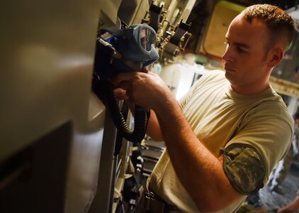 Staff Sgt. Christopher Mills 437th Operations Support Squadron aircrew flight equipment craftsman and flightline work center NCO in charge, replaces an oxygen mask on board a C-17 Globemaster III as part of an inspection at Joint Base Charleston, S.C., June 22. Airmen assigned to the 437th OSS AFE flight ensure that aircrew equipment including helmets, oxygen masks, life rafts, and parachutes are safe and ready for aircrew members to operate. 